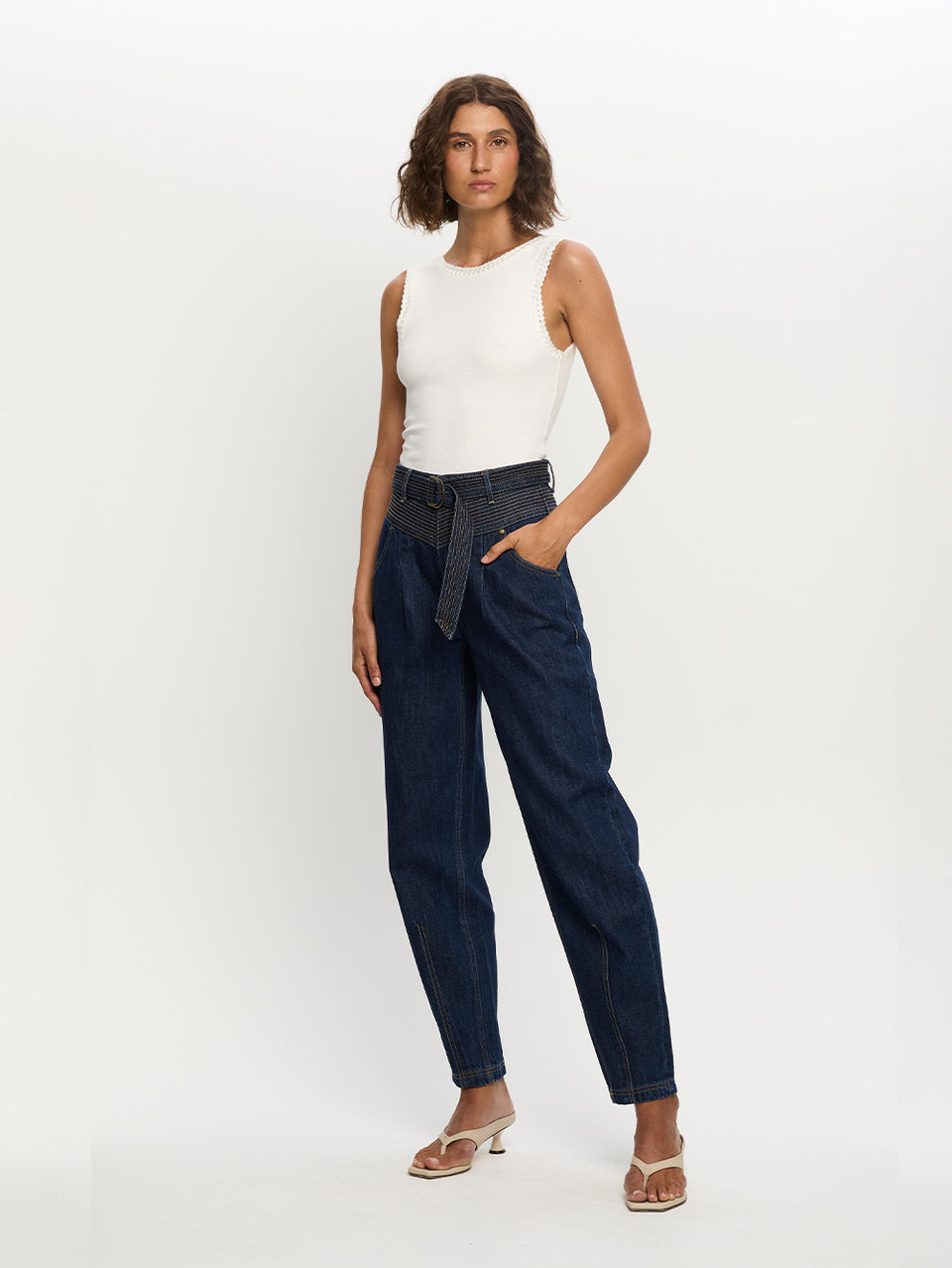 Woman in blue jean with belt 