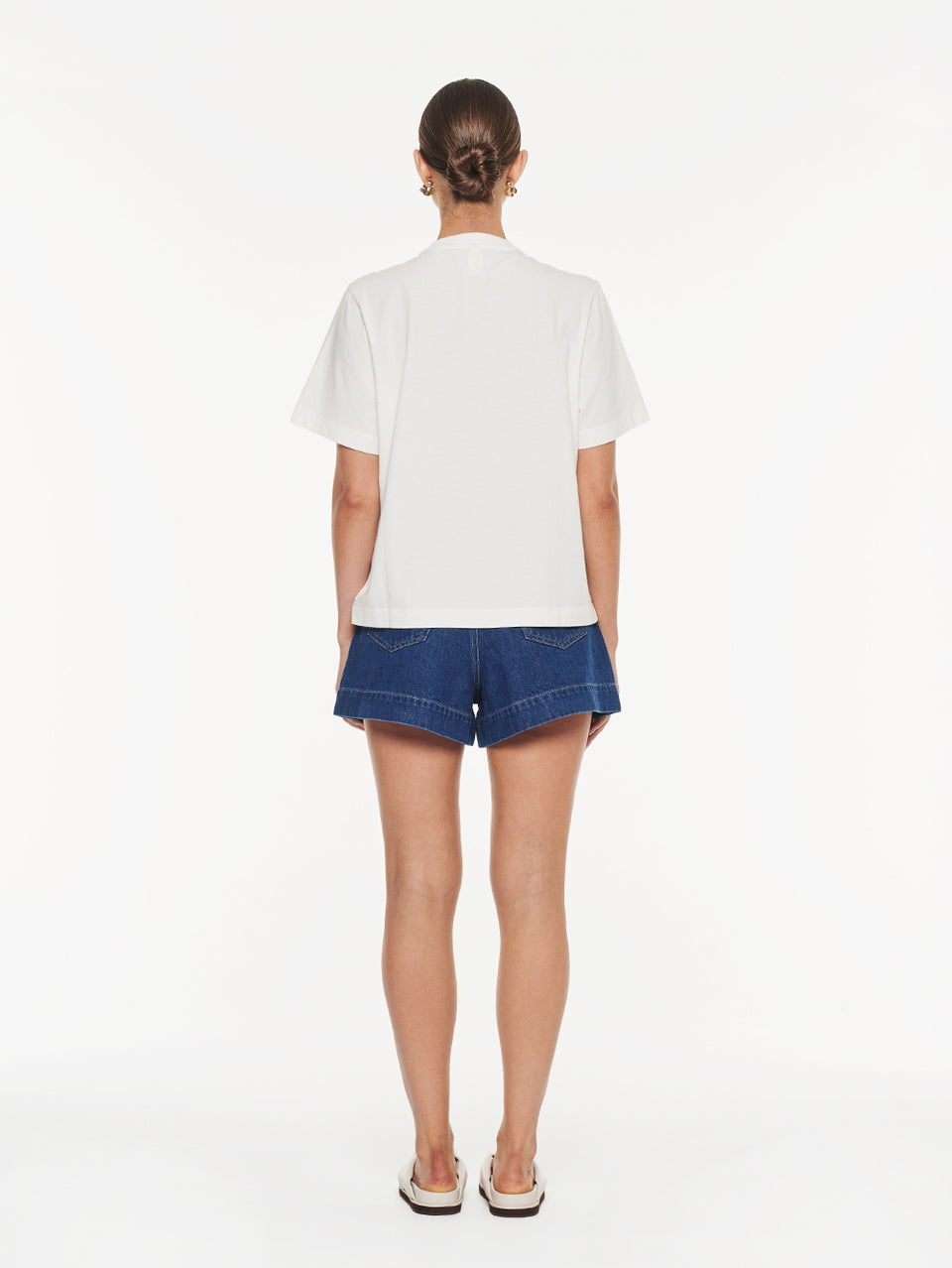 Lotte Tee in Yellow print, back view of crewneck graphic t-shirt with denim shorts