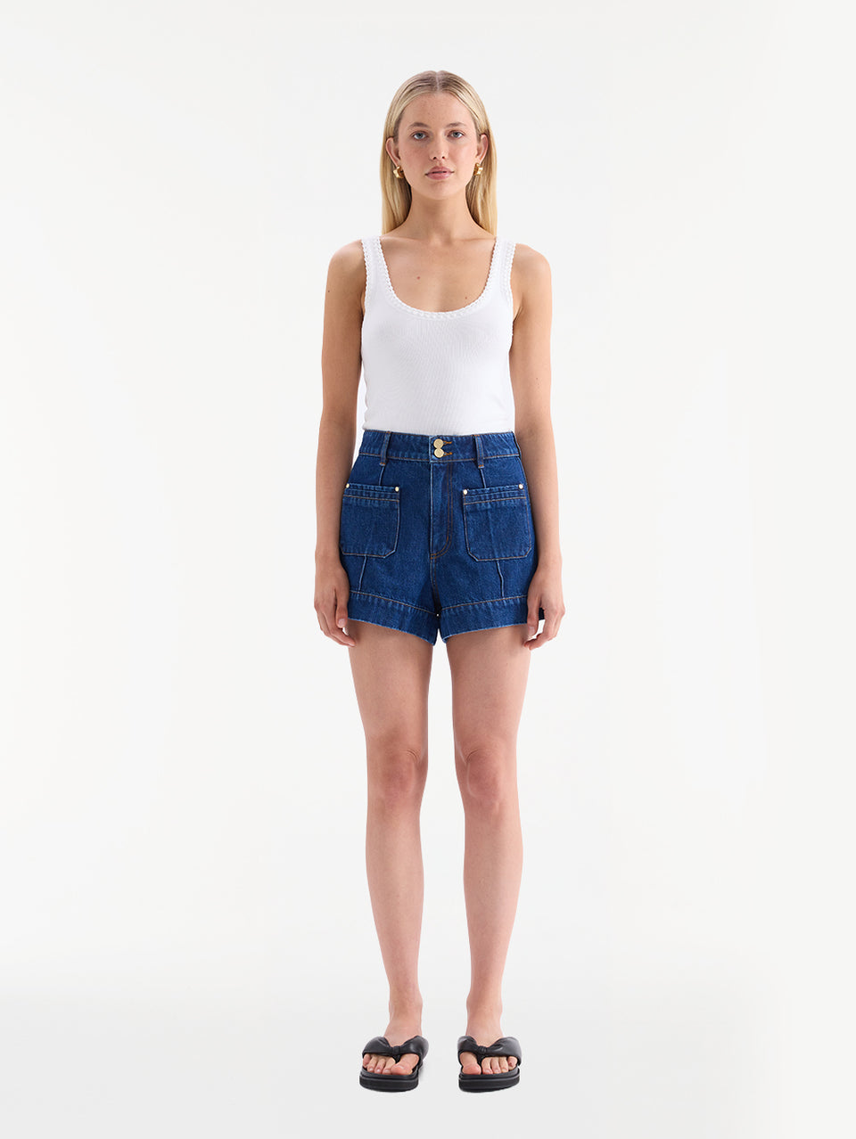 KIVARI Hanna denim shorts with white tank top and black sandals, front view
