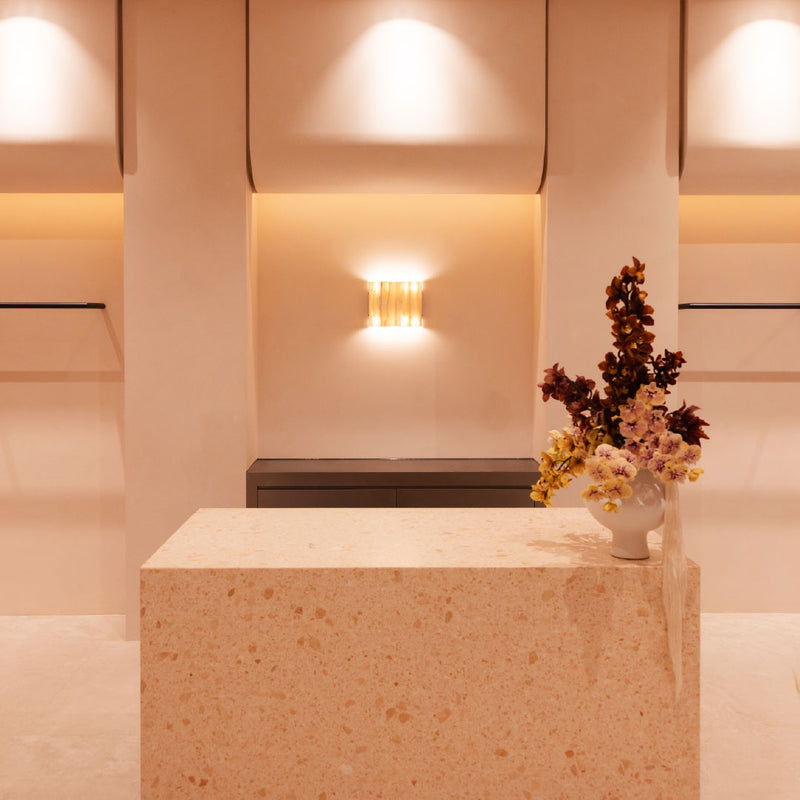 KIVARI Westfield Miranda store homepage banner, stone plinth styled with dried floral arrangement